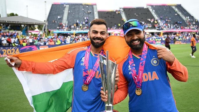 two men holding up a trophy